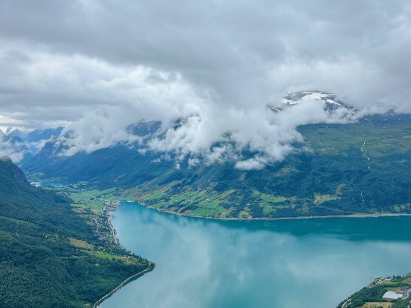 a large body of water with a mountain in the background