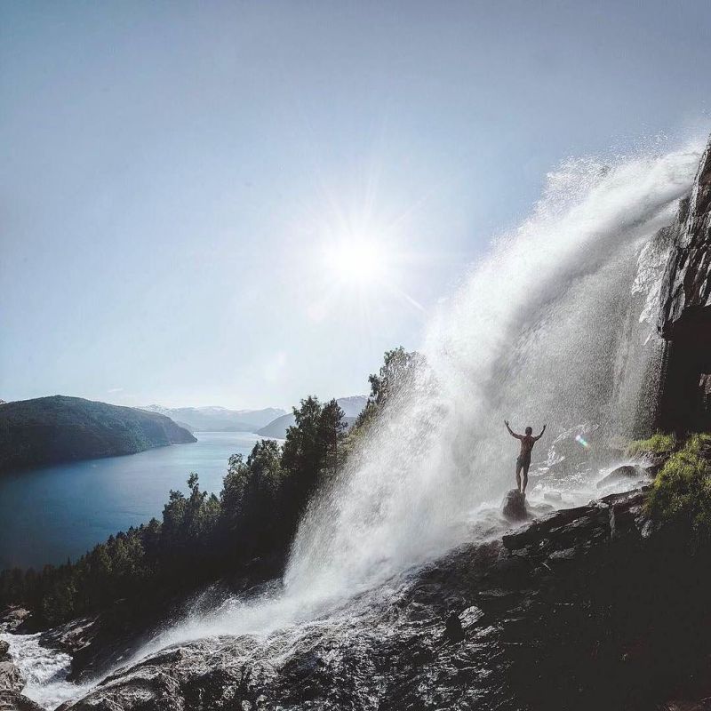 a man riding a wave on a surfboard in the water