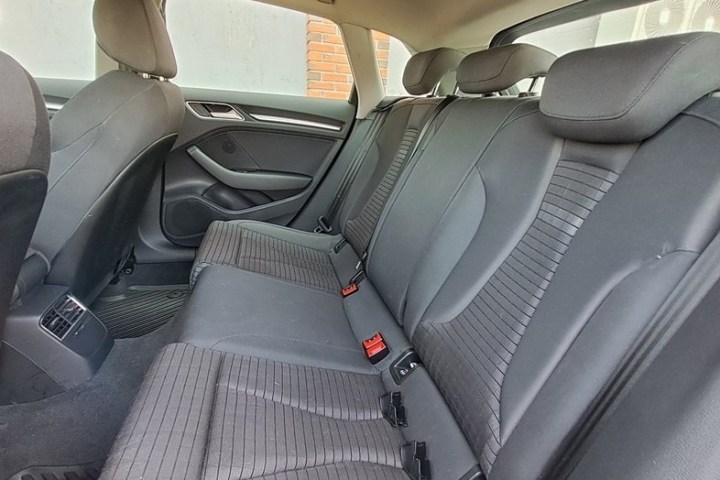 a motorcycle parked on the seat of a car